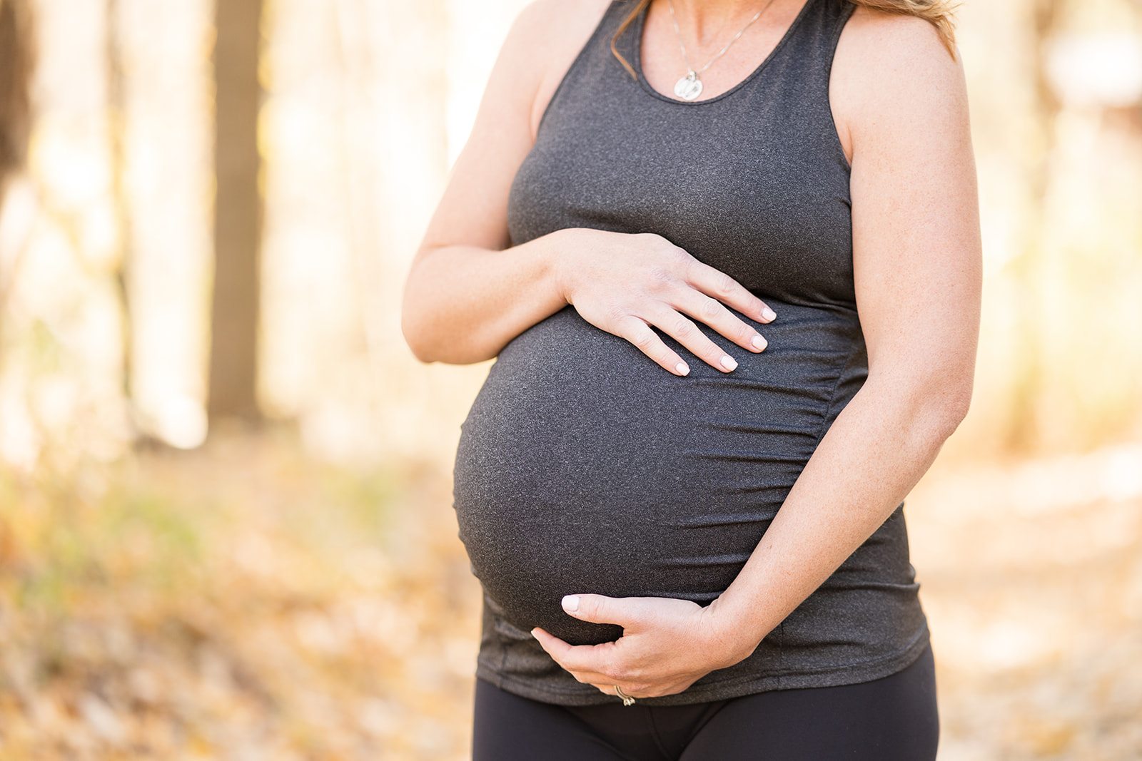 Pregnant mother holding her belly